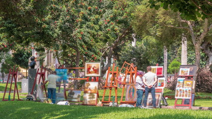 Miraflores central park timelapse. Place for relax with green trees and lawn in Peruvian capital. Lima, Peru