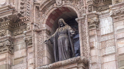 Wall Mural - Staue on The Basilica Cathedral of Lima is a Roman Catholic cathedral located in the Plaza Mayor timelapse hyperlapse in Lima, Peru