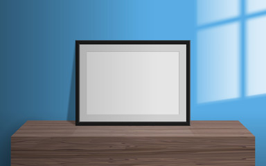 Wall Mural - empty blank picture frame on wooden table window light effect on the wall mock up 