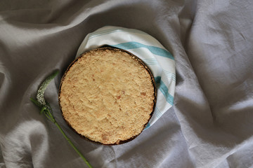 cake with crumbs on a tablecloth