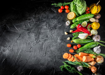  Assortment of fresh vegetables on a dark background. Concept of healthy food, fresh vegetables. Top view with copy space