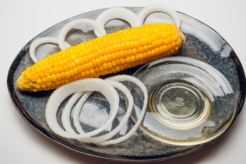 Wall Mural - fresh corn vegetable with green leaves isolated on white background.