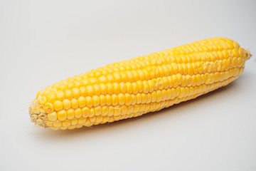 Wall Mural - fresh corn vegetable with green leaves isolated on white background.