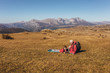 © Mediteraneo - Boy camping with grandfather in autumn.