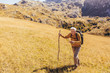 © Mediteraneo - Senior man on hike through beautiful countryside in autumn.