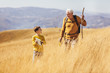 © Mediteraneo - Senior man with grandson on country walk in autumn.