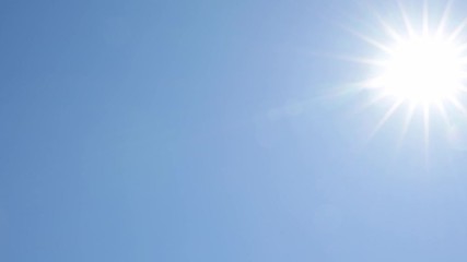 sun traveling across clear blue sky, hot sunny day, looking into the summer sky, lens flare, 4k