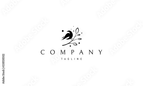 Cuadros en Lienzo Vector logo on which an abstract image of a bird sitting on a branch