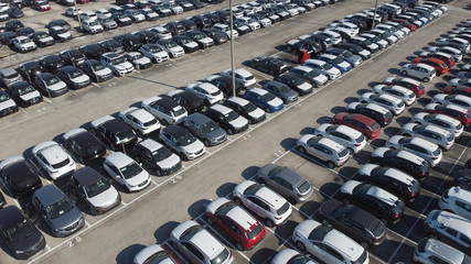 LOGISTIC AND TRADE AUTOMOBILE CENTER. DRONE AERIAL PHOTO. VEHICLE PARK