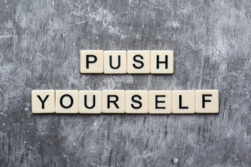 Push yourself motivation formed with plastic tiles