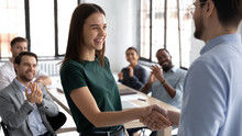 Businessman Shake Hand Of Excited Caucasian Female Employee Greeting With Achievement Or Success At Office Meeting, Male Boss Or CEO Handshake Happy Woman Worker Congratulate With Work Promotion