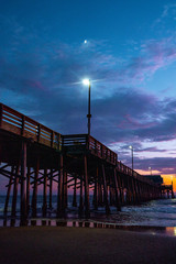 Wall Mural - low angle view of newport beach pier during sunset