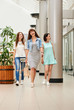 © Denys Kurbatov - Three young beautiful women having fun and walking in shopping mall