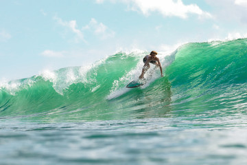 Wall Mural - boy surfing in sea