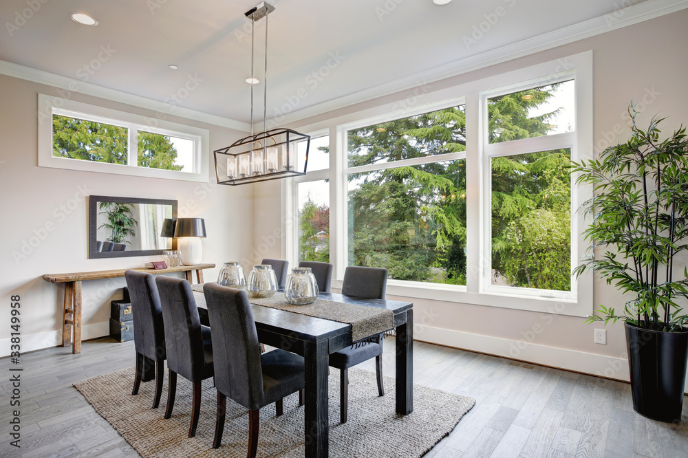 Luxurious modern dining room boasts a black dining table Stock Photo ...