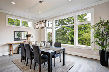 Wall Mural - Luxurious modern dining room boasts a black dining table