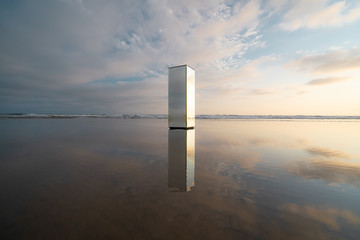 Wall Mural - view of mirrored pillar on beach