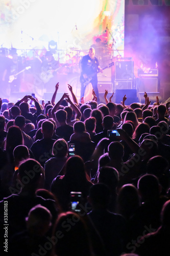 Fotografía Fans at live rock music concert cheering