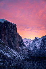 Wall Mural - dramatic sunset over snowy mountains in winter