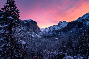 Wall Mural - dramatic sunset over snowy mountains in winter