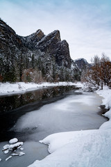 Wall Mural - view of frozen river and mountains in winter