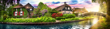 Landscape Of Giethoorn Village With Water Canals And Rustic Houses In Netherland Wide Banner Or Panorama.