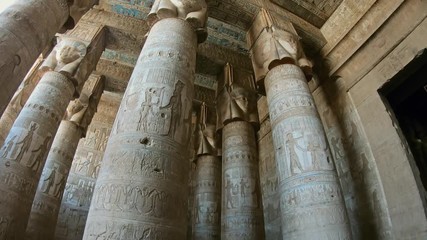 Wall Mural - Interior of the painted and carved hypostyle hall at Dendera Temple. Ancient Egyptian temple near Qena. Tilt view 4k