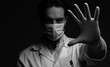 © Teodor Lazarev - Virus mask male doctor wearing face protection in prevention for coronavirus showing gesture Stop Infection