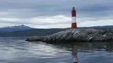 Les Eclaireurs Lighthouse At The Harbor Entrance At Ushuaia, Tierra Del Fuego Province, Argentina.