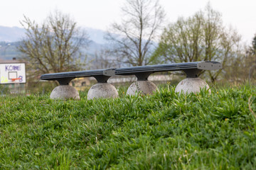 Low angle view of two empty park benches