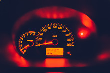 Close-up Of Illuminated Red Speedometer In Car