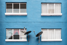 Full Frame Shot Of Windows On Blue Wall