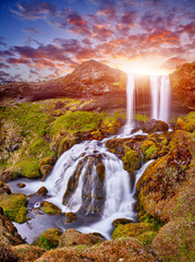 Wall Mural - Sheep's Waterfall. Famous tourist landscape. Travel concept background. Dramatic summer sunrise, Iceland, Atlantic Ocean, Europe. Travel postcard. Amazing Sunset. Beautiful Sunrise. Virgin Nature.