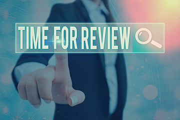 Wall Mural - writing note showing time for review. business concept for review of a system or situation in its fo