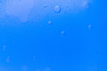 Abstract  Underwater air bubbles, round shape, water frozen in time, blue background, clean backdrop texture