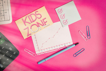 Poster - Text sign showing Kids Zone. Business photo text An area or a region designed to enable children to play and enjoy Stationary and note paper plus math sheet with diagram picture on the table