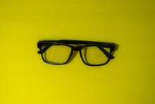 Directly Above Shot Of Eyeglasses Against Green Background