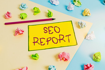 Fototapete - Writing note showing Seo Report. Business concept for notifying on how website is performing in search engine results Colored crumpled papers empty reminder blue yellow clothespin