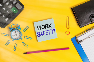 Poster - Text sign showing Work Safety. Business photo text policies and procedures in place to ensure health of employees Alarm clipboard calculator wallet clip band pencil notepad color background