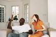 © SHOTPRIME STUDIO - young couple watching tv in living room