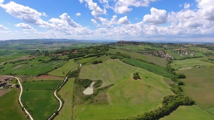 Wall Mural - Tuscany aerial panorama with road and cypresses of farmland hill country. Italy, Europe, 4k