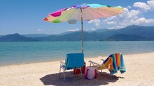 Two Lounge Chairs On Idyllic Sunny Beach