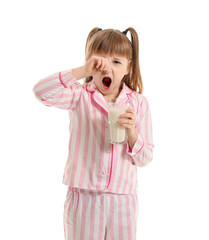 Wall Mural - Sleepy little girl with glass of milk on white background