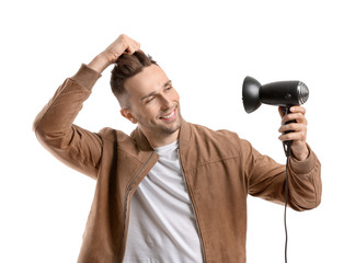 Sticker - Handsome young man with hair dryer on white background