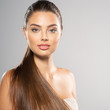 © Valua Vitaly - Portrait of a beautiful woman with a long hair. Young  brunette model with  beautiful hair - isolated on white background. Young girl with clean fresh skin oа a face.