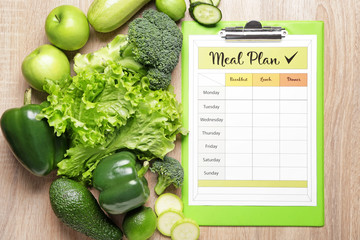 Wall Mural - Healthy products and meal plan on wooden background