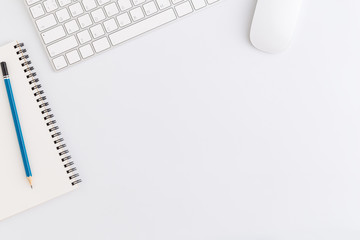 Wall Mural - flat lay photo of office desk with mouse and keyboard, copy space on white background, top view.