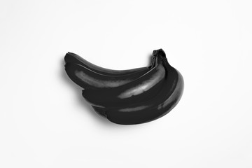 Black Banana on white background. Not an illustration.High-resolution photo.