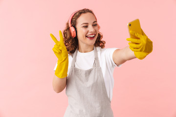 Wall Mural - Positive young woman take selfie by mobile phone