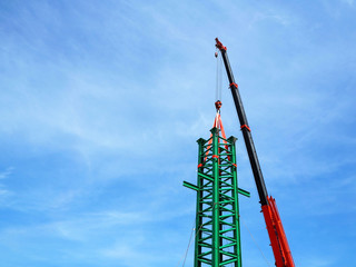 Man Working on the Working at height on construction site with blue sky